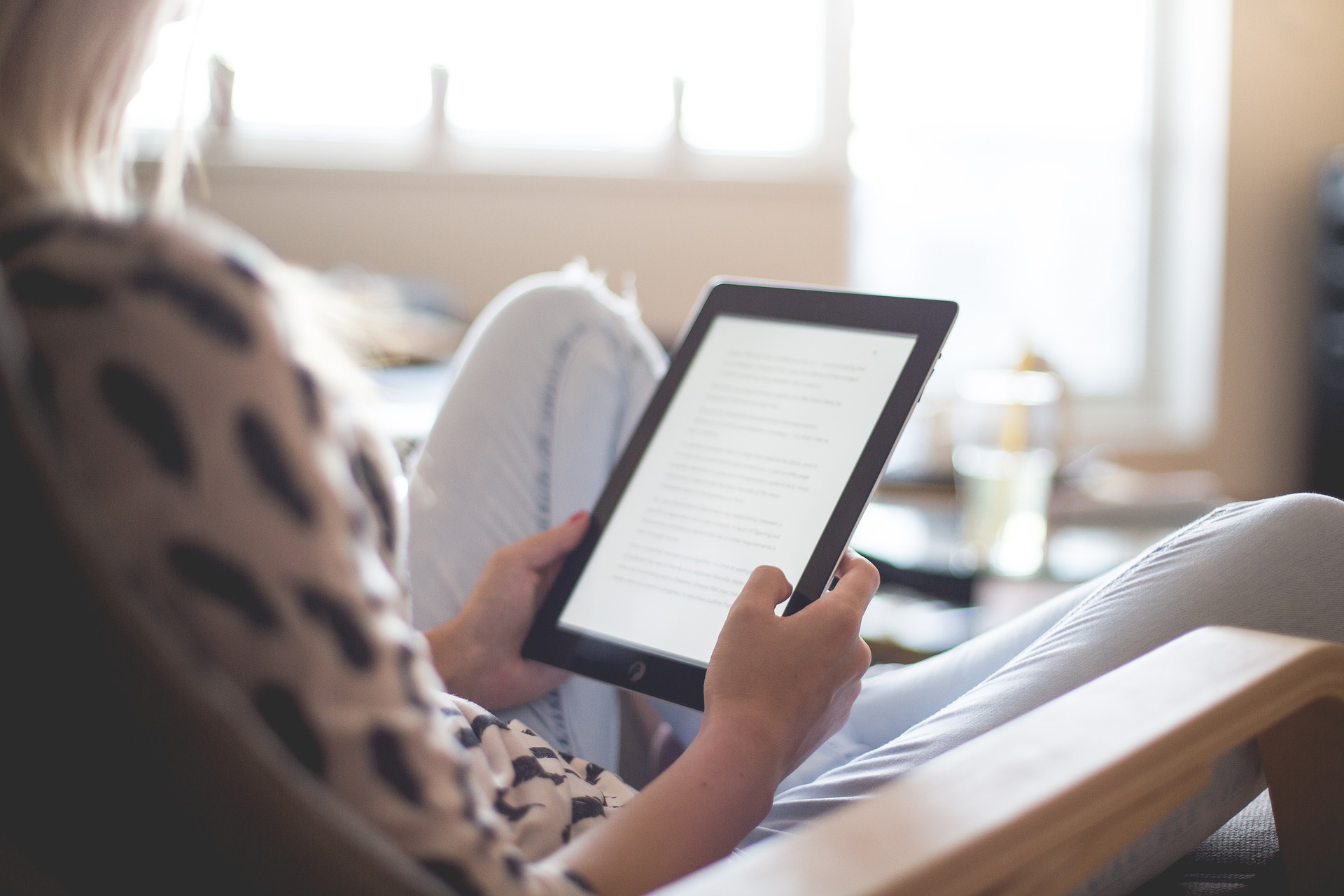 person holding a e-reading device